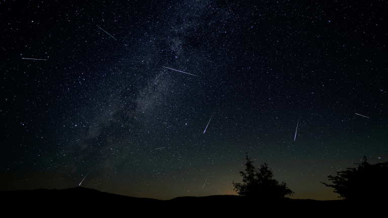 Meteor shower over the mountains near heritage accommodations in Alberta