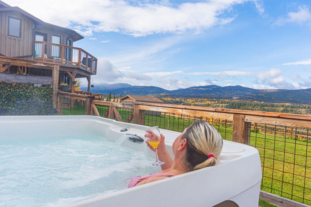 woman enjoying hot tub at jasper b and b